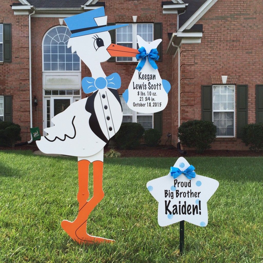 Stork yard sign and sibling star