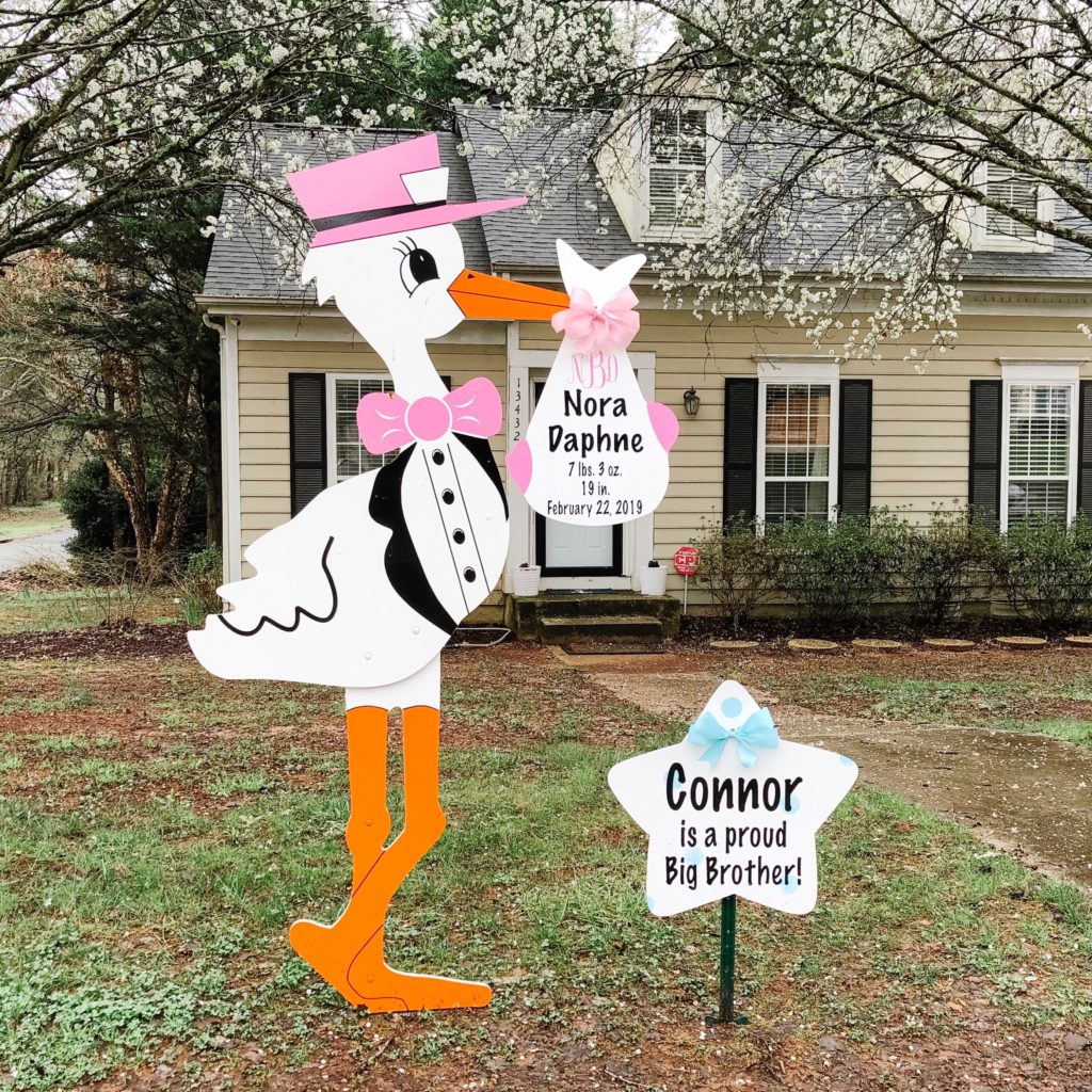 Stork lawn signs to announce a new baby